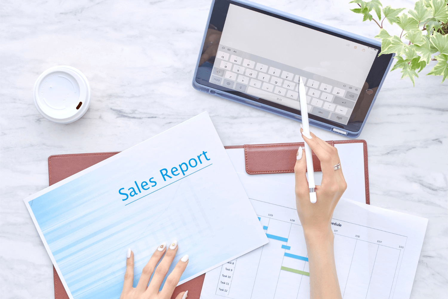 Sales report displayed on a tablet with a pen resting on a desk, highlighting the issue of traffic but no sales.