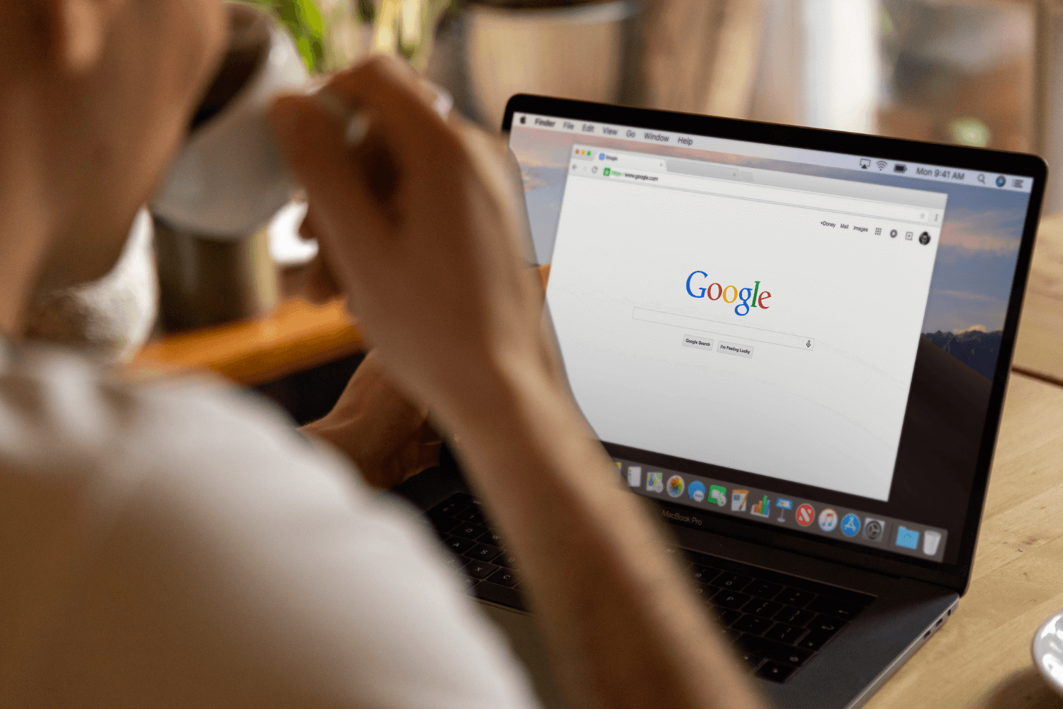Small business owner researching SEO basics on a laptop
