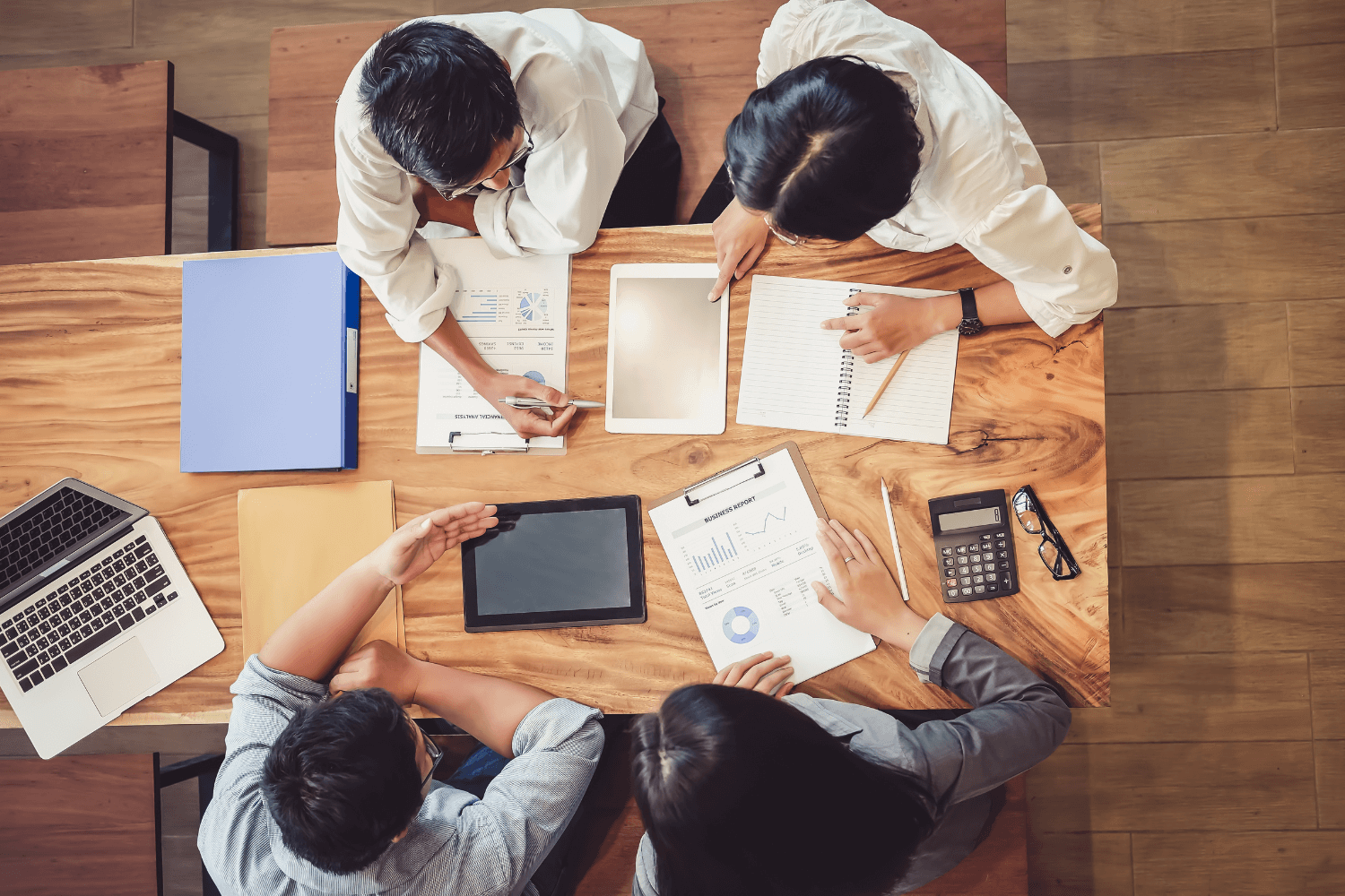 Overhead photo of a laptop and checklist showing a marketing audit in progress