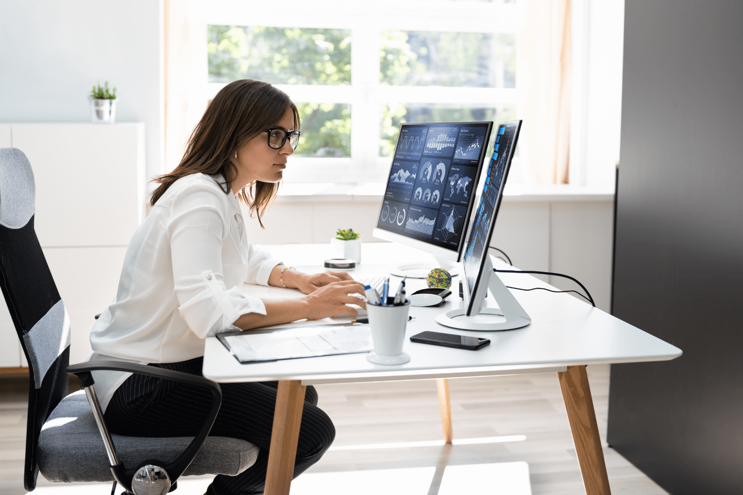 Business owner analysing website SEO performance on laptop
