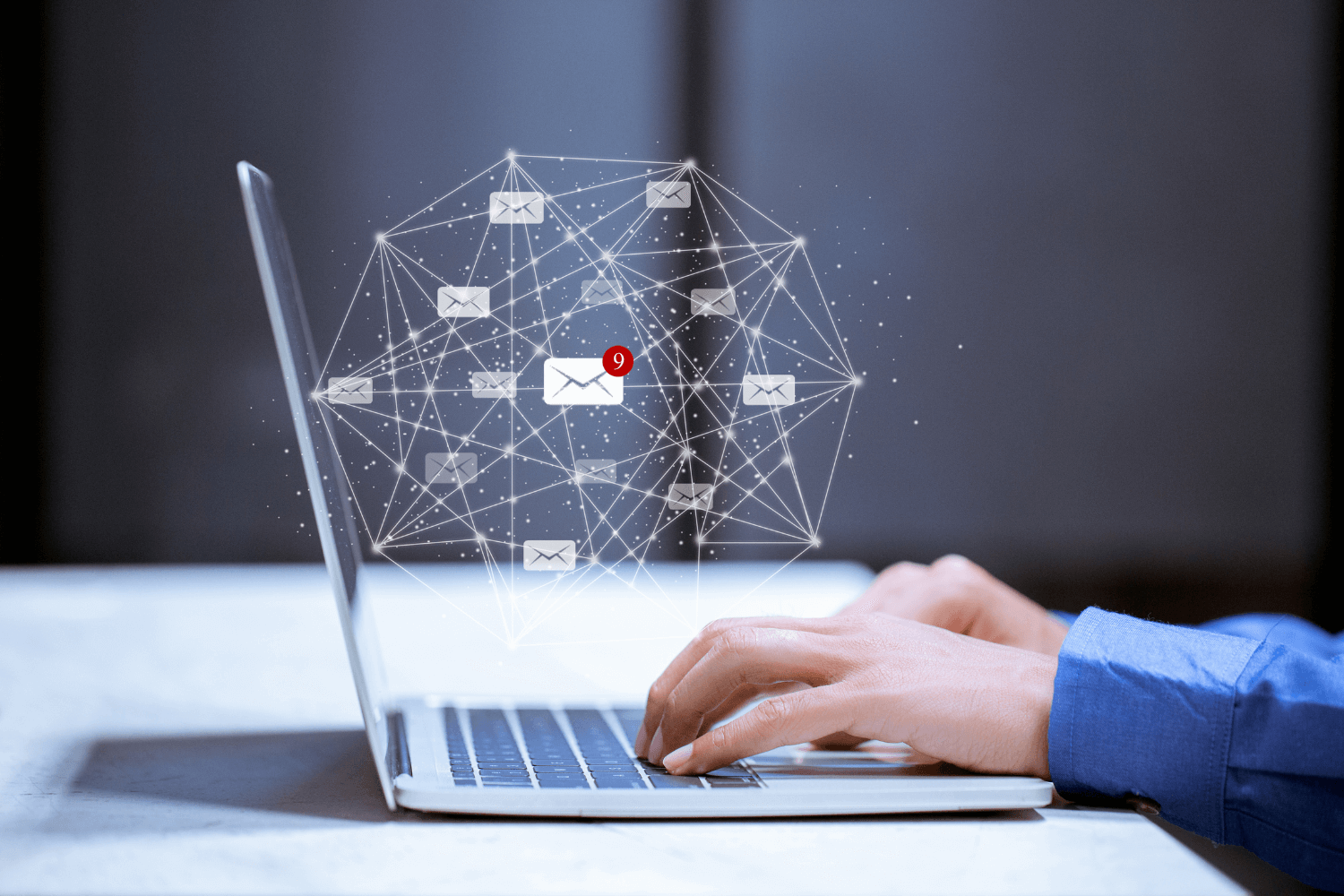 Flat lay of laptop with email marketing visuals, representing small business strategy