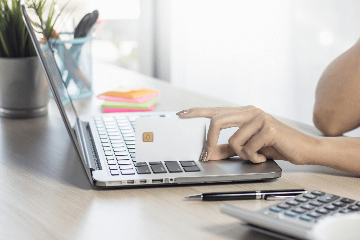 Flatlay of clean beauty skincare products next to a laptop with email campaign on screen