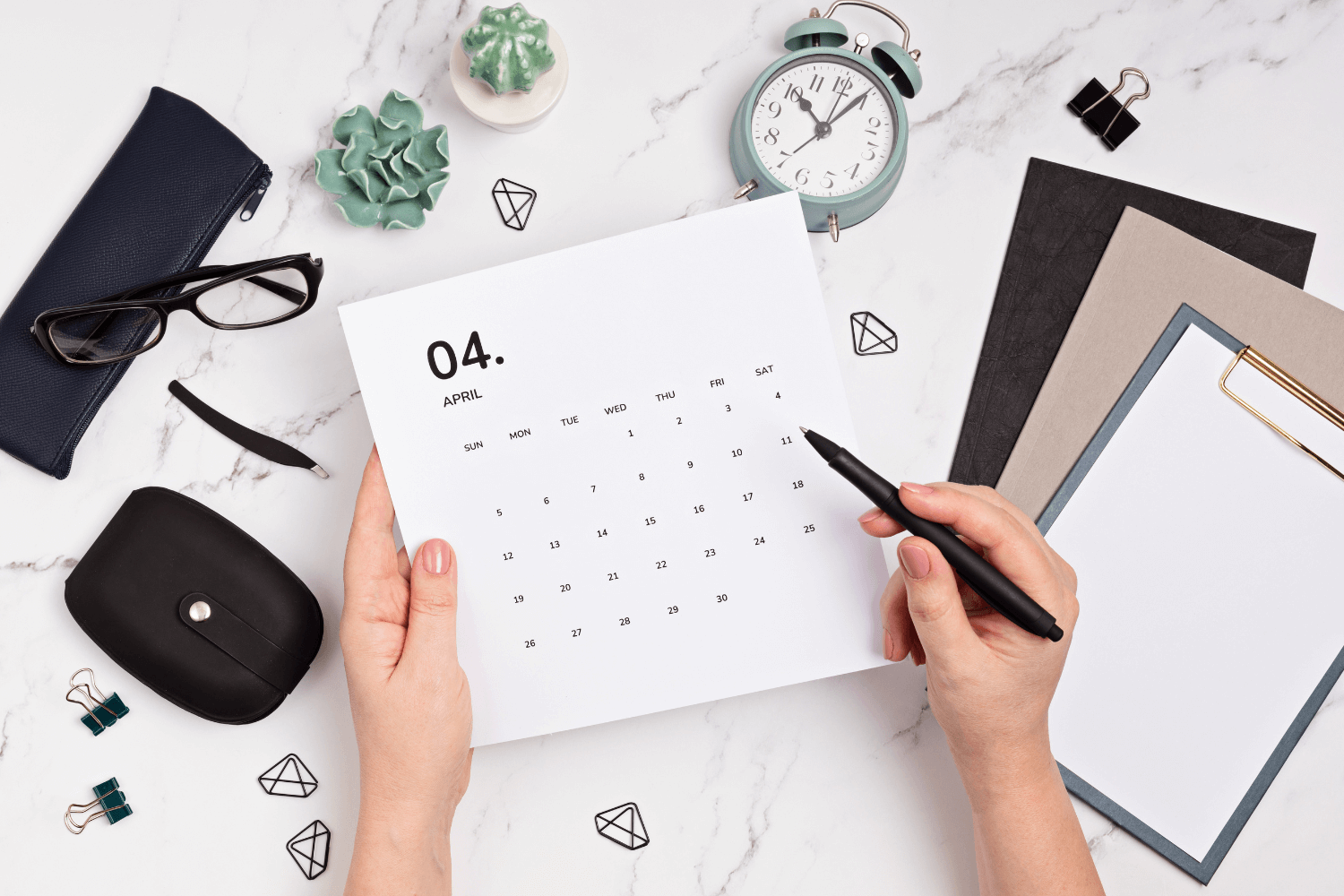 Flatlay of social media content calendar with notes and phone