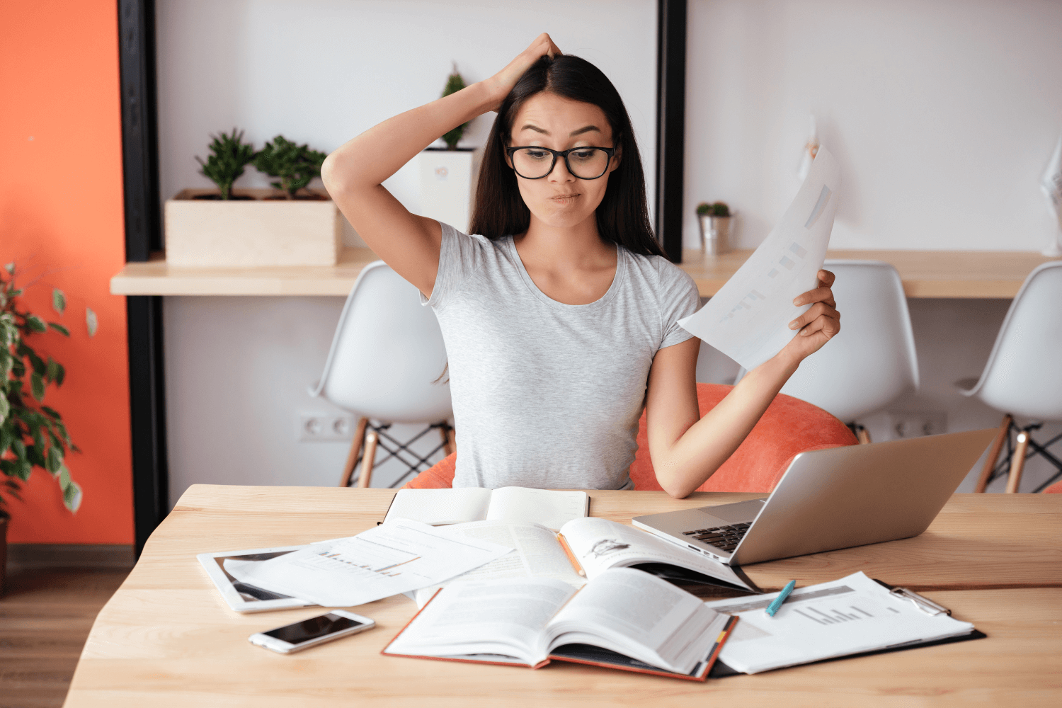 Business owner reviewing marketing performance on a laptop with charts and graphs